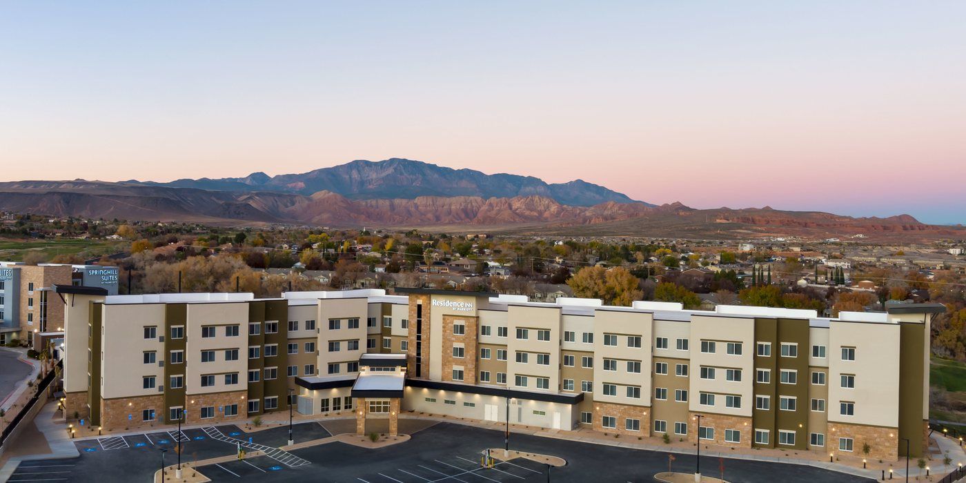 The Residence Inn St. George at dusk, home of Back Nine Bistro & Bar, with Pine Valley Mountain behind it